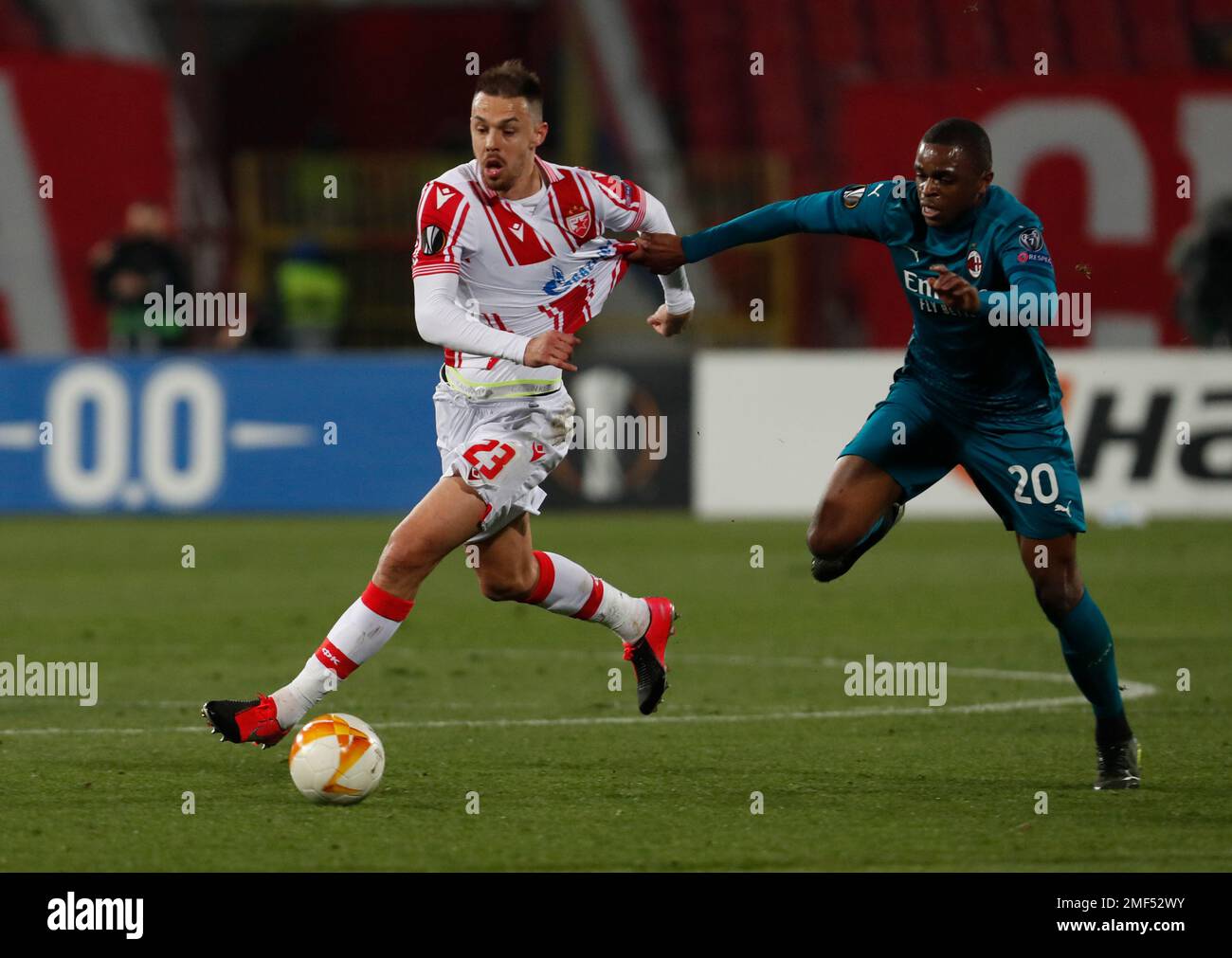 Red Star's Milan Rodic, left, duels for the ball with AC Milan's Pierre ...
