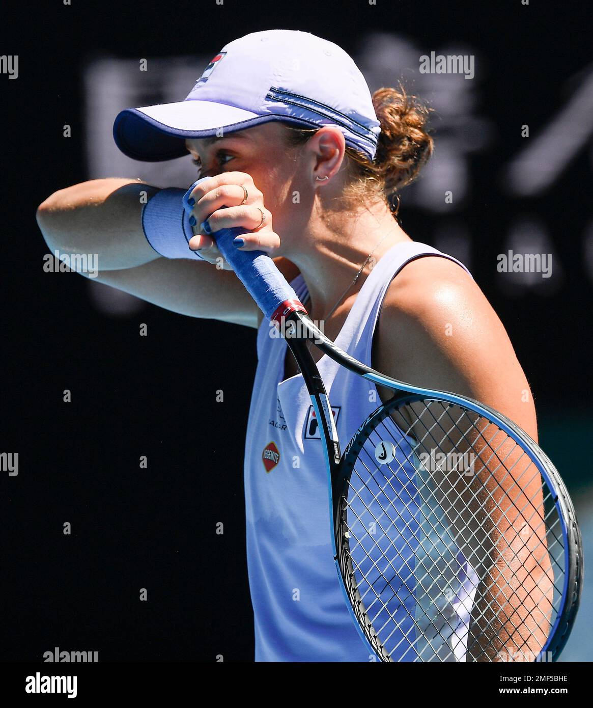 Australia's Ash Barty wipes the sweat from her face during her quarterfinal  match against Karolina Muchova of the Czech Republic at the Australian Open  tennis championship in Melbourne, Australia, Wednesday, Feb. 17,