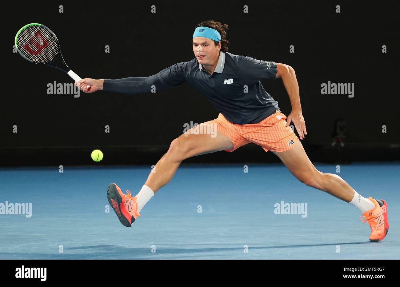 Canada's Milos Raonic hits a forehand return to Serbia's Novak Djokovic  during their fourth round match at the Australian Open tennis championship  in Melbourne, Australia, Sunday, Feb. 14, 2021.(AP Photo/Hamish Blair Stock