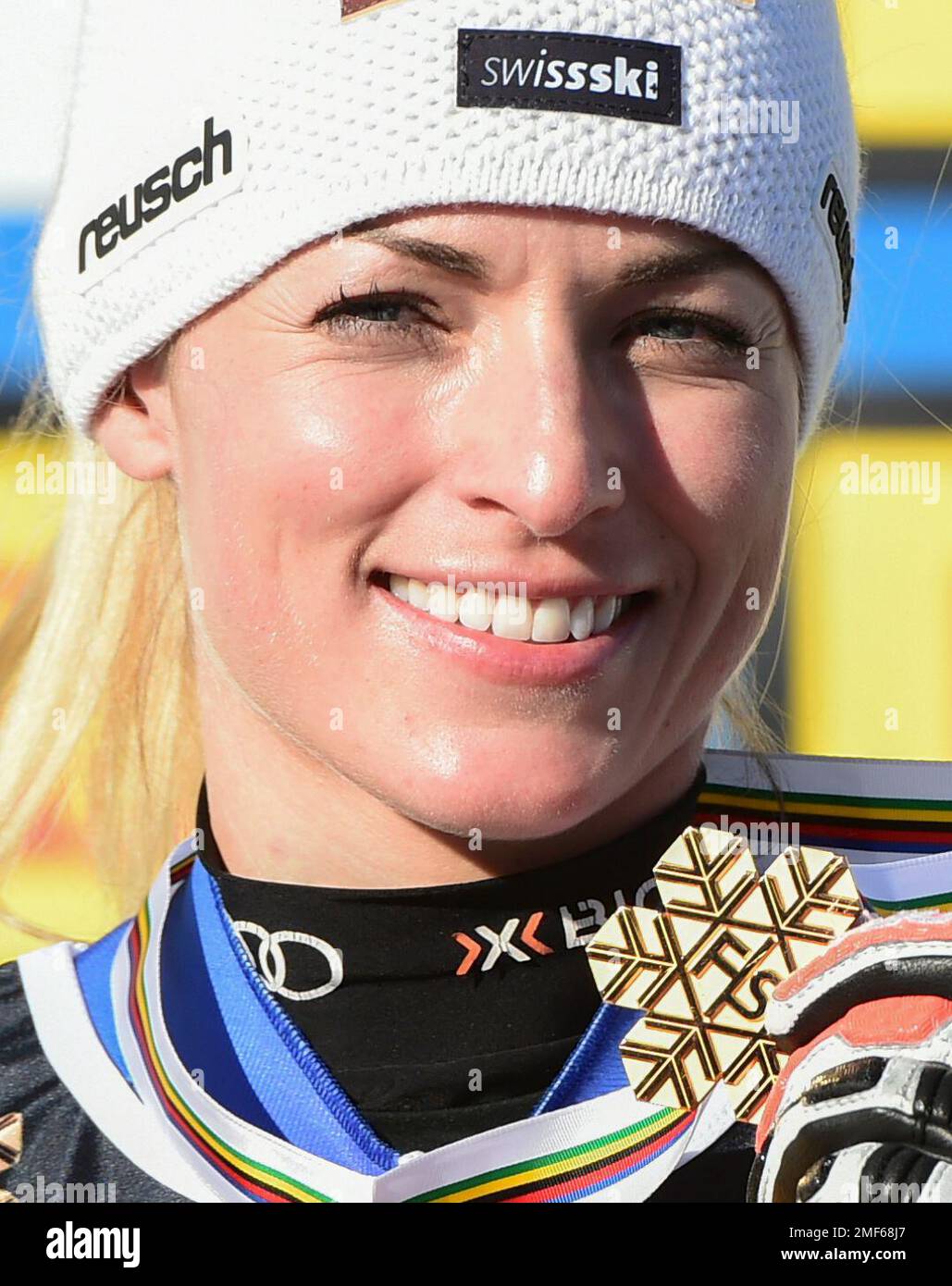 Switzerland's Lara Gut-Behrami shows her gold medal in the women's super-G, at the alpine ski World Championships, in Cortina d'Ampezzo, Italy, Thursday, Feb. 11, 2021. (AP Photo/Marco Tacca) Stock Photo