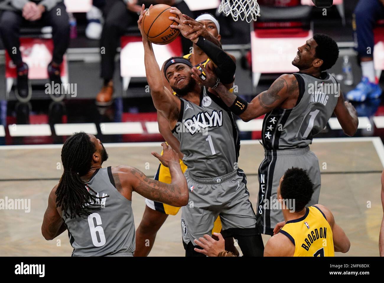 Brooklyn Nets Bruce Brown 1 Kyrie Irving 11 and DeAndre Jordan 6 compete for control of the ball with Indiana Pacers Myles Turner and Malcolm Brogdon during the first half of an