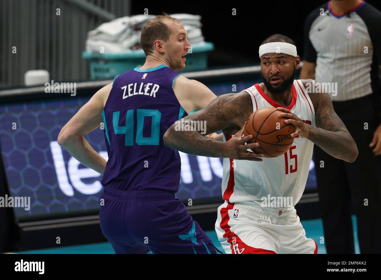 Houston Rockets center DeMarcus Cousins, right, spins to th basket ...