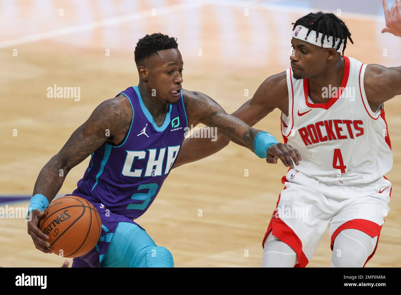 Charlotte Hornets guard Terry Rozier, left, brings the ball up court ...
