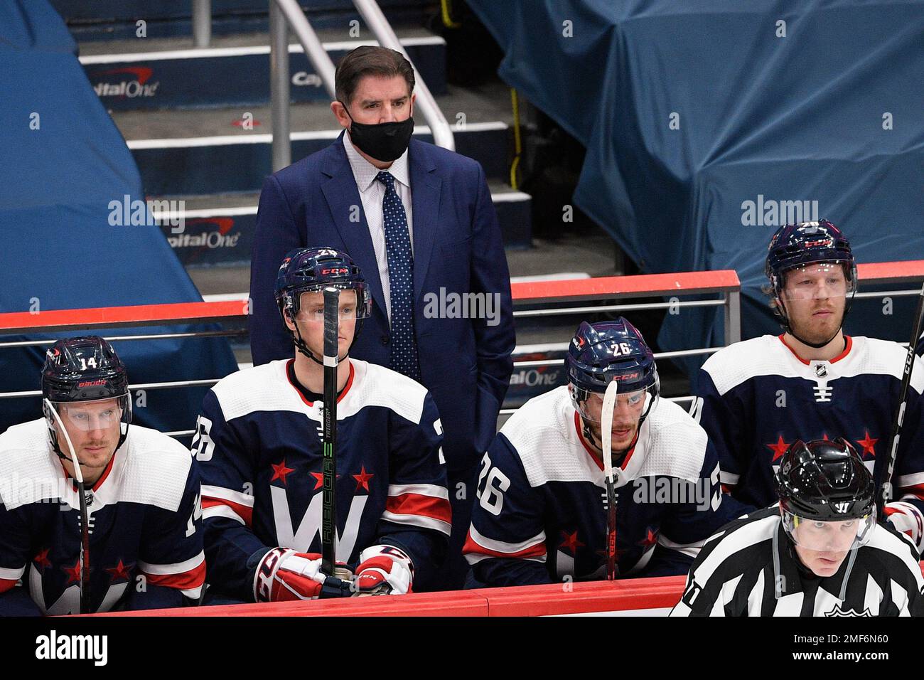 Washington Capitals head coach Peter Laviolette, top, watches during