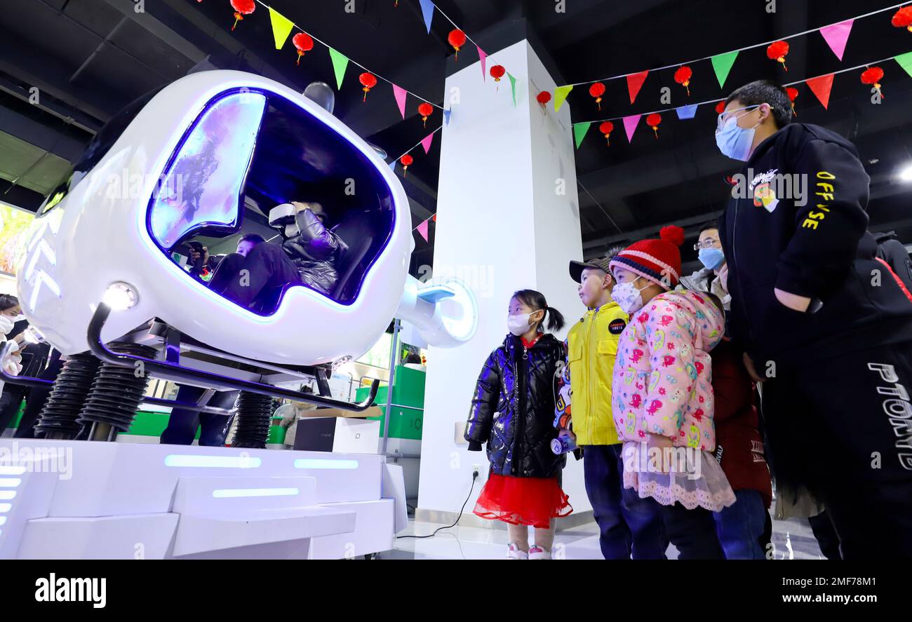 ZHANGYE, CHINA - JANUARY 24, 2023 - Children fly a simulated airplane at the Zhangye Science and Technology Museum in Linze county of Zhangye city, No Stock Photo
