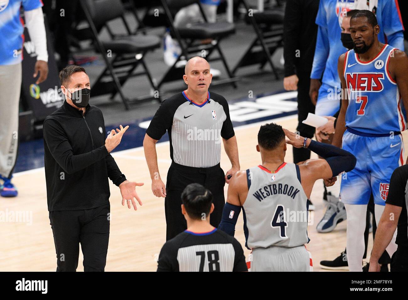 Brooklyn Nets head coach Steve Nash, left, talks to an official during