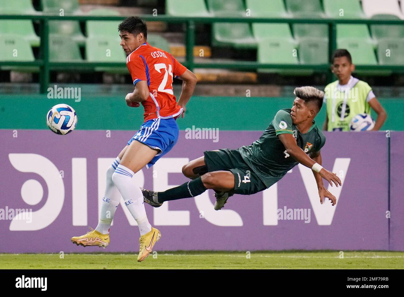 Bolivia's Denilson Duran, right, and Chile's Dario Osorio, fight for