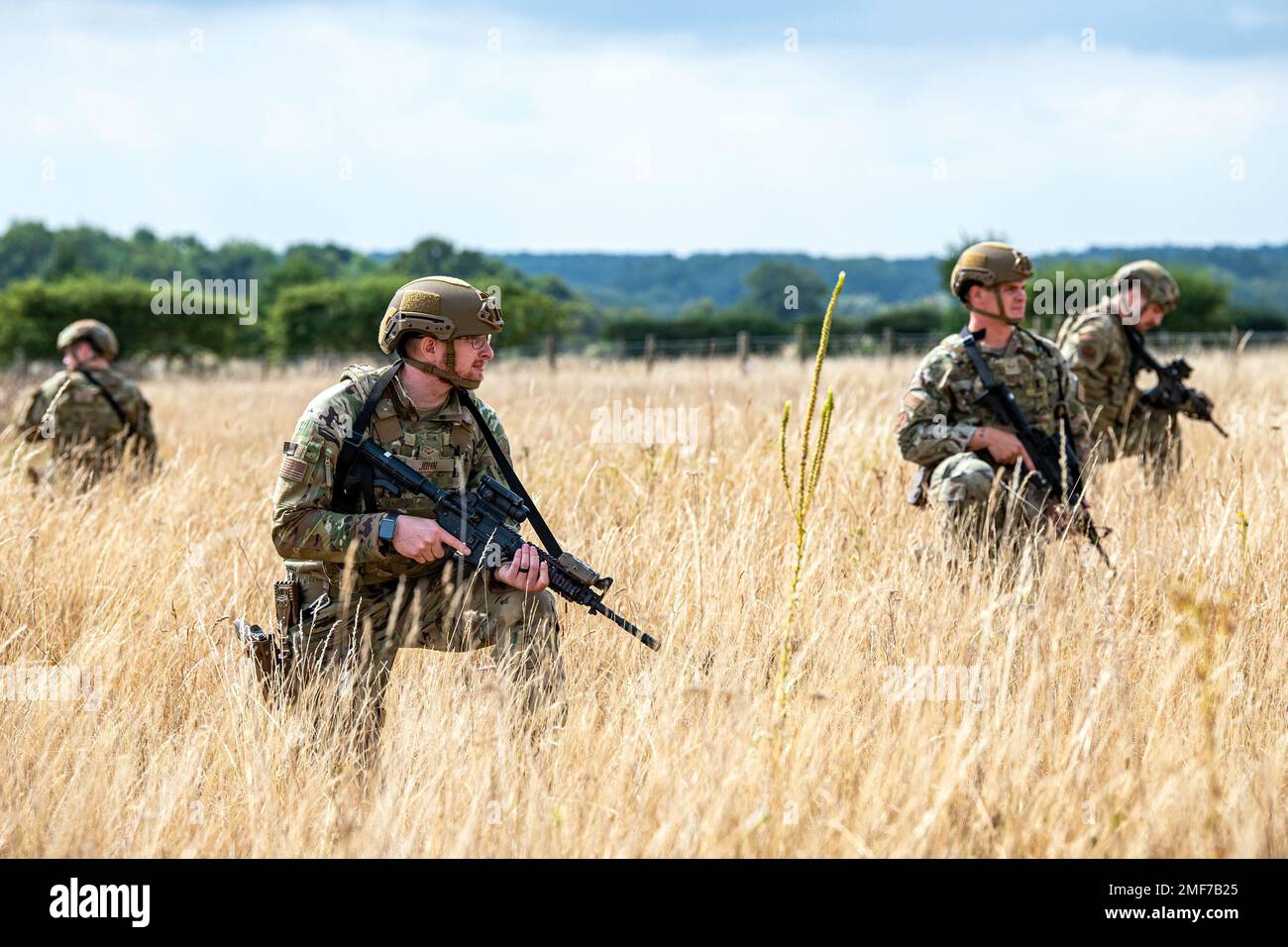 Airmen from the 423d Security Forces Squadron hold their position during a field training exercise at Stanford Training Area, England, Aug. 17, 2022. Instructors from the 820th Base Defense Group and 435th Security Forces Squadron Ground Combat Readiness Training Center, conducted the exercise to evaluate and bolster the combat readiness skills of the defenders from the 423d SFS. Stock Photo