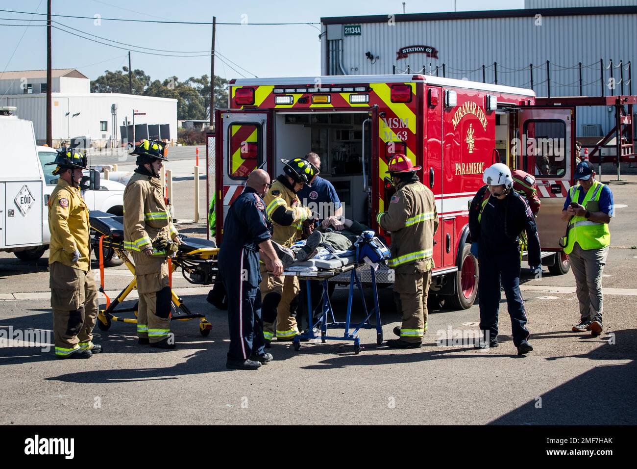 San Diego Emergency Services and Marine Corps Air Station Miramar firefighters move a simulated