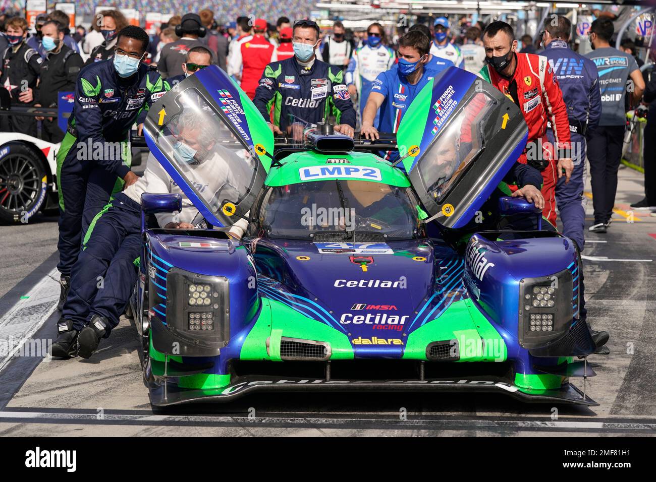 The crew of the Cetilar Racing Dallara LMP2 (47) push the car on pit