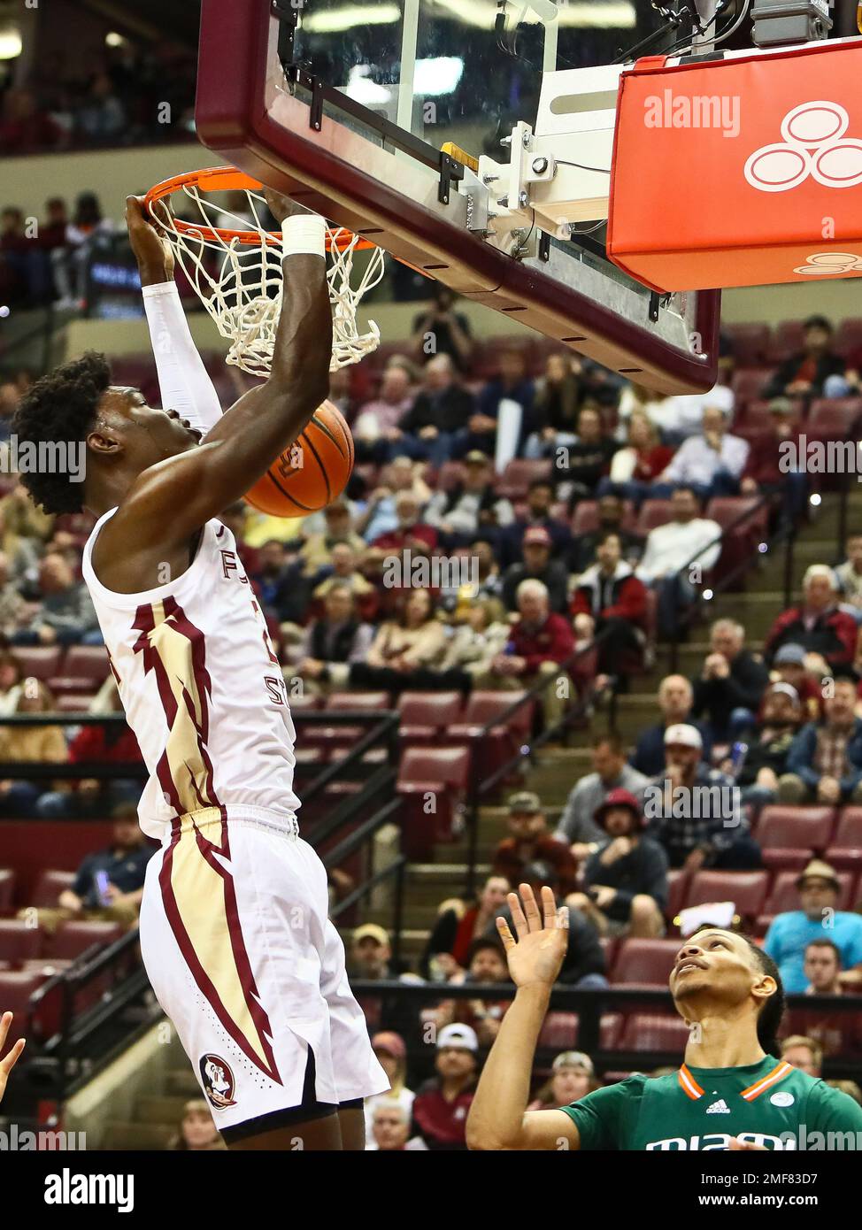 Florida State center Naheem McLeod (24) dunks the ball in the first