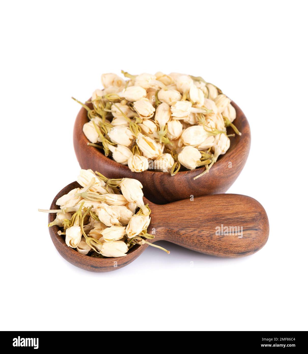 Dry jasmine flowers in wooden bowl and spoon, isolated on white
