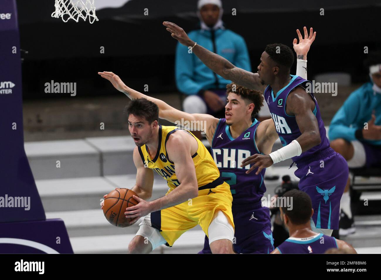 Los Angeles Lakers forward LeBron James, right, dunks past Charlotte Hornets  guard LaMelo Ball (2) during the first half of an NBA basketball game  Thursday, March 18, 2021, in Los Angeles. (AP