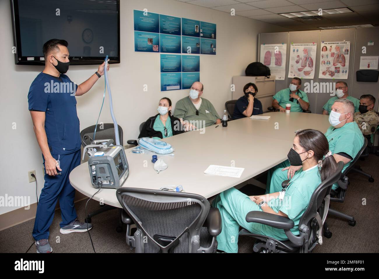 Vendor representative Carlo Tan trains a group of respiratory