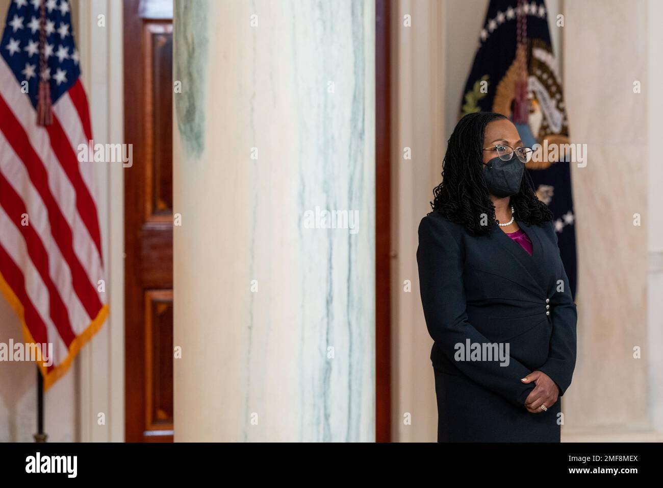 Reportage: Judge Ketanji Brown Jackson looks on as President Joe Biden announces her nomination to the U.S. Supreme Court, Friday, February 25, 2022, in the Grand Foyer of the White House Stock Photo