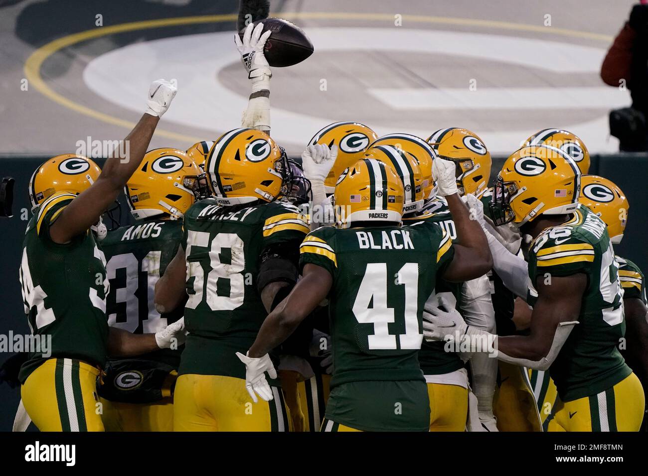 Green Bay Packers' Jaire Alexander intercepts a pass in front of