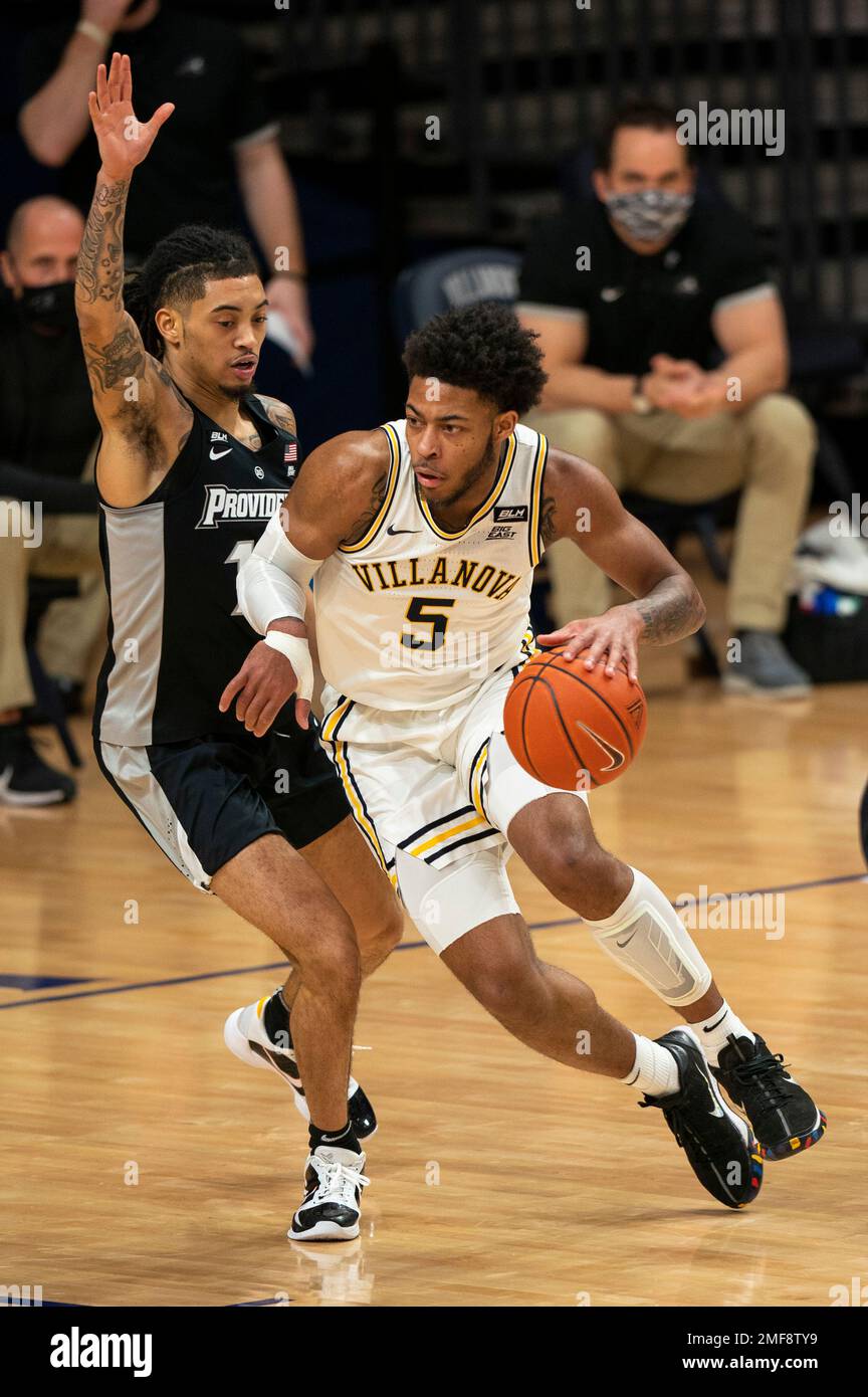 Villanova's Justin Moore, right, makes his move against Providence's