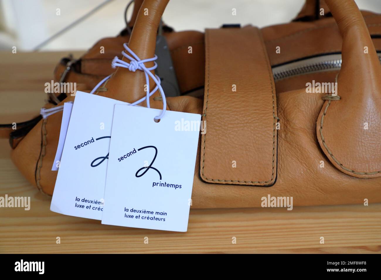 A vintage handbag with Second 2 Printemps tag for sale in 2e Printemps (Second Printemps) store at 7ieme Ciel (Seventh Heaven) in the 7th floor of Au Printemps department store.Paris.France Stock Photo