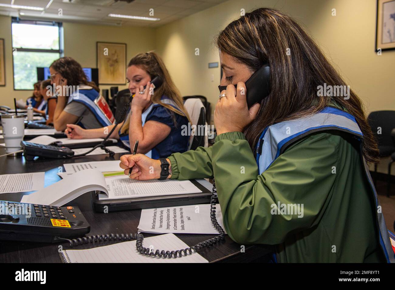 Juana Altamirano, a staff member at the Commander, Fleet Activities Sasebo (CFAS) Fleet and Family Support Center (FFSC), receives calls at a simulated emergency family assistance center at the CFAS FFSC as part of Exercise Citadel Pacific 2022 (CP22) Aug. 18, 2022. CP22 is an annual exercise that is not in response to any specific real-world threat but is used to evaluate the readiness of fleet and installation security programs. Stock Photo