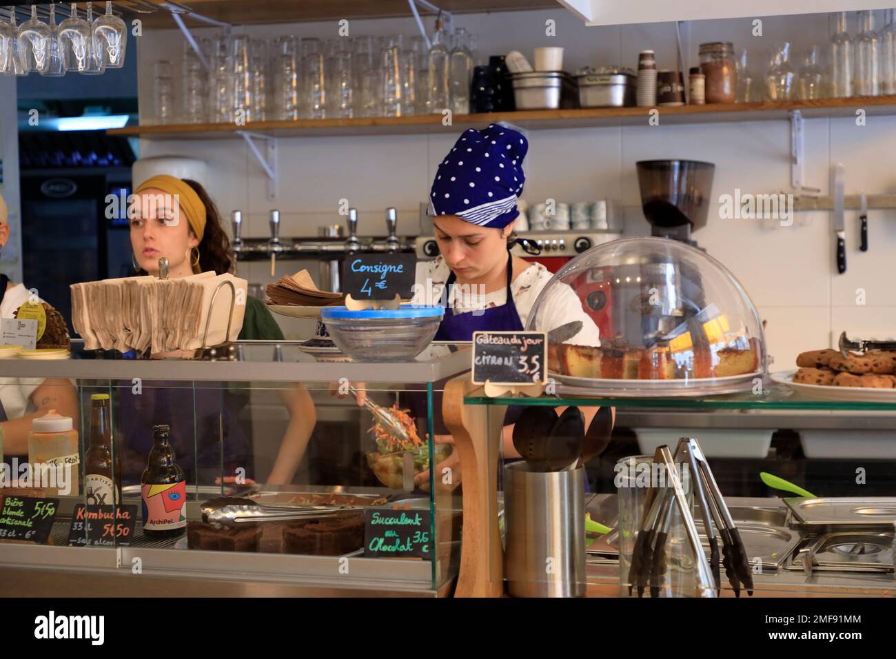 Female restaurant workers working in Le Bichat, a eco-friendly and vegetarian friendly restaurant serving organic and farm to table food and drinks in 10th arrondisse Stock Photo
