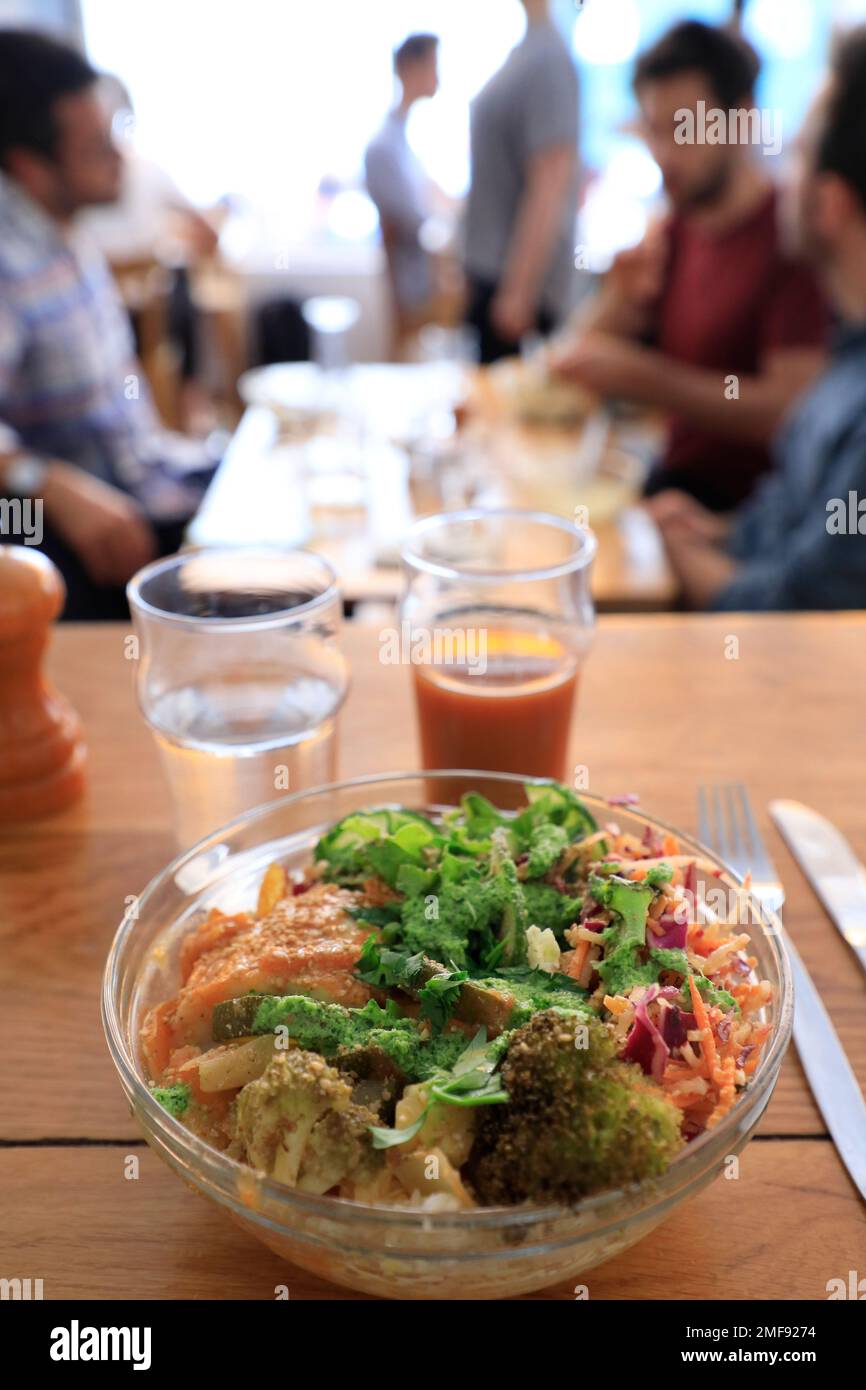 A bowl of salmon with vegetables served in Le Bichat, a eco-friendly and vegetarian friendly restaurant serving organic and farm to table food and drinks in 10th arrondissement of Paris.France Stock Photo