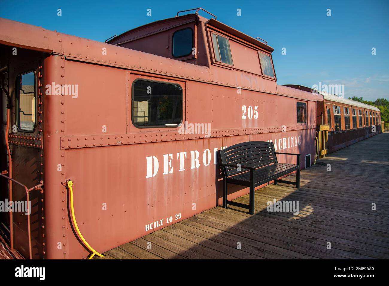 Passenger cars and old caboose stored at historic Standish Michigan