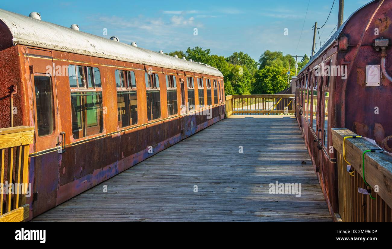 Passenger cars and old caboose stored at historic Standish Michigan
