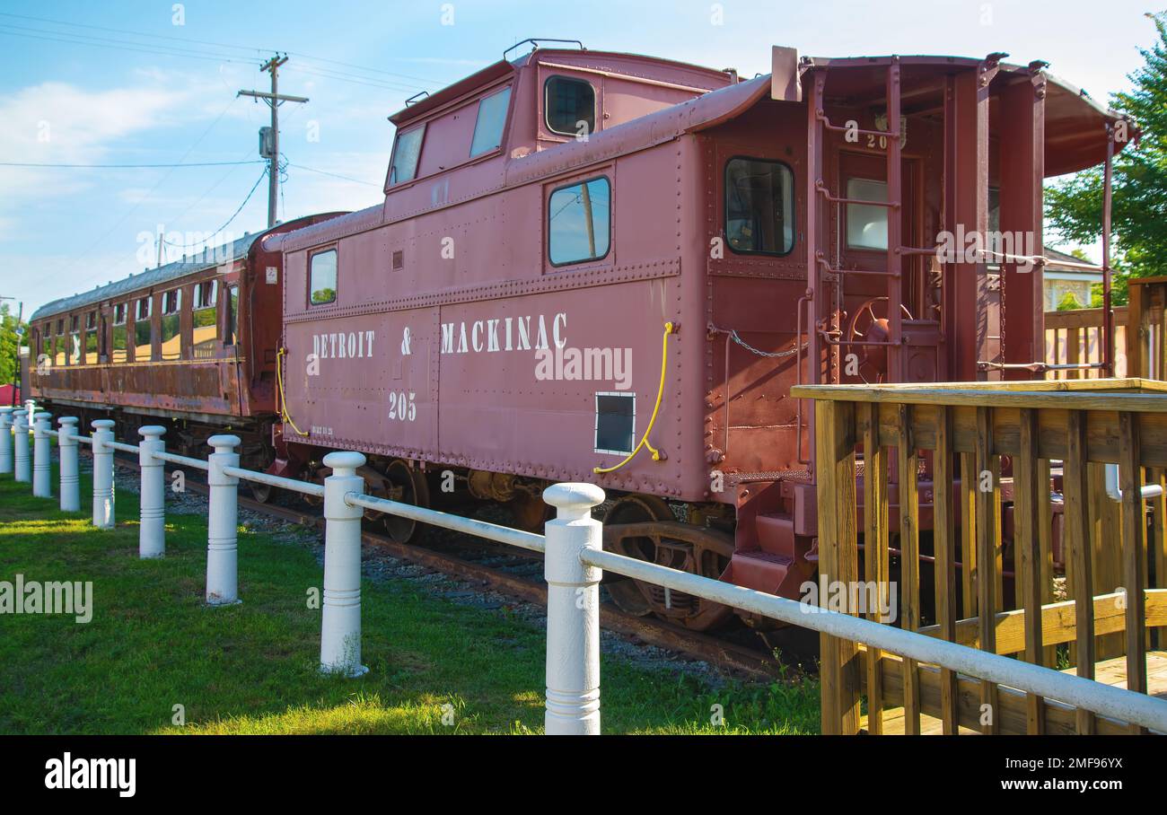 Passenger cars and old caboose stored at historic Standish Michigan