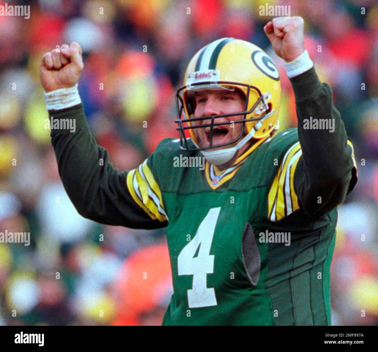 FILE - In this Sunday, Jan. 12, 1997, file photo, Green Bay Packers  quarterback Brett Favre celebrates in the fourth quarter of a 30-13 win  against the Carolina Panthers in the NFC