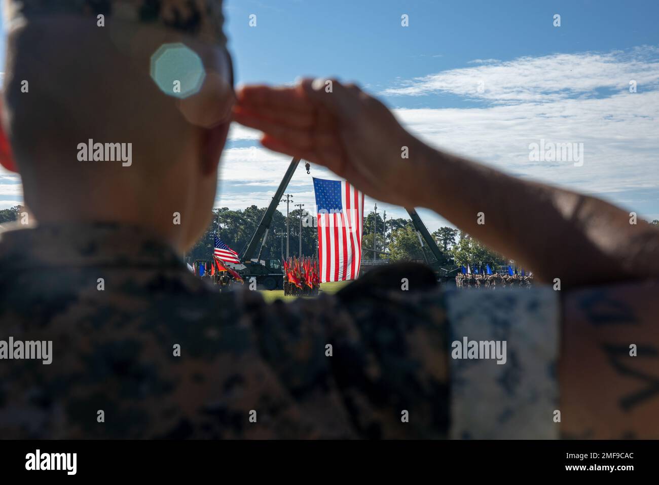 U.S. Marines with II Marine Expeditionary Force (MEF) render a salute during the II MEF change of command ceremony, Marine Corps Base Camp Lejeune, N.C., August 18, 2022. Lt. Gen. William M. Jurney relinquished command to Lt. Gen. David A. Ottignon. Stock Photo