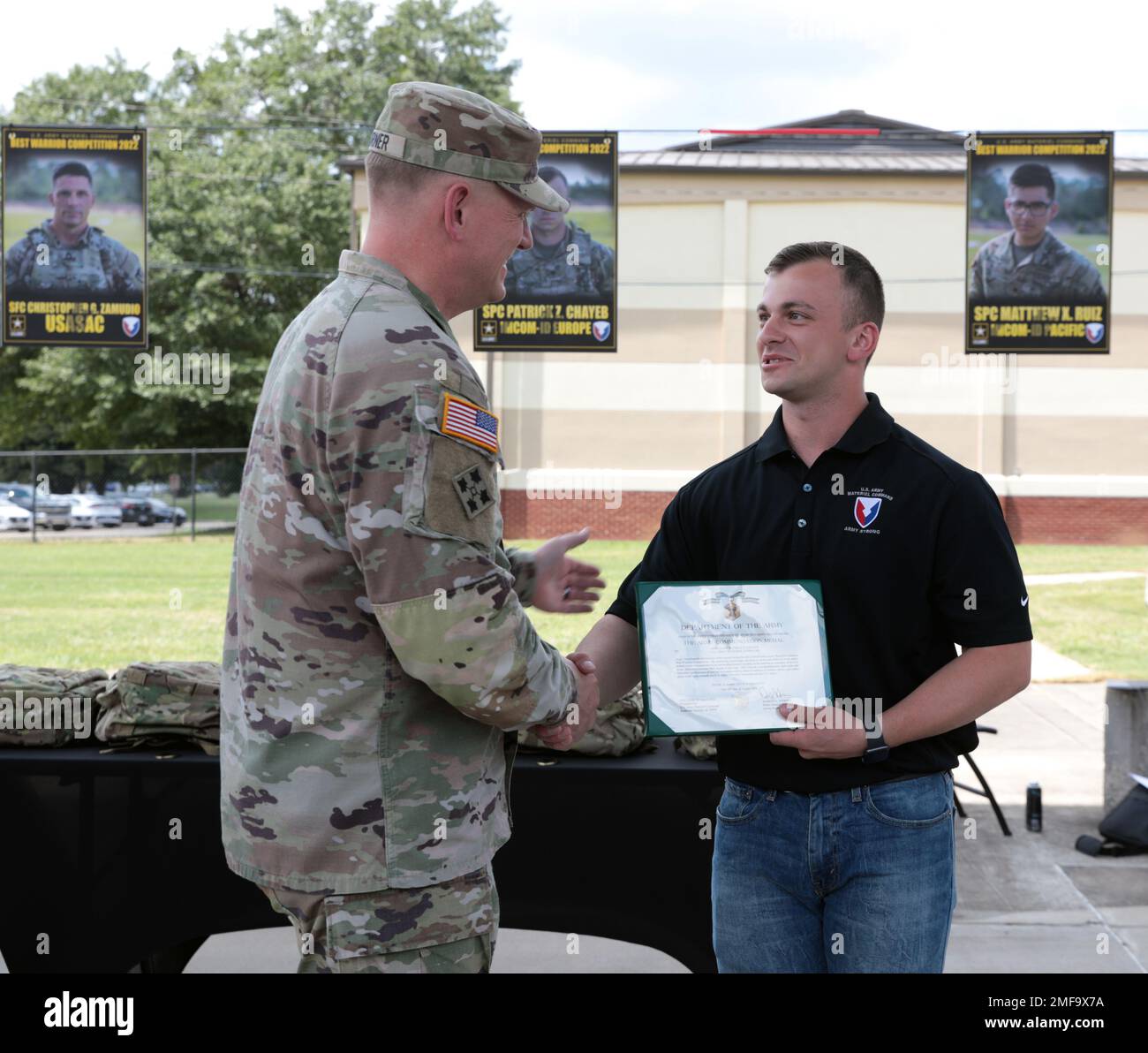 Maj. Gen. Darren Werner, Army Materiel Command acting deputy commanding general, awards an Army Commendation Medal to Spc. Patrick Chayeb following his selection to AMC’s Best Squad during an August 18 luncheon at Redstone Arsenal, Ala. Chayeb serves as a military police officer at U.S. Army Garrison-Benelux. Stock Photo