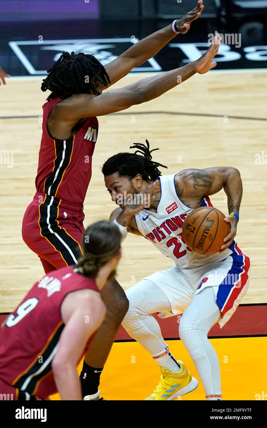 Detroit Pistons guard Derrick Rose, right, drives to the basket as Miami Heat forward KZ Okpala