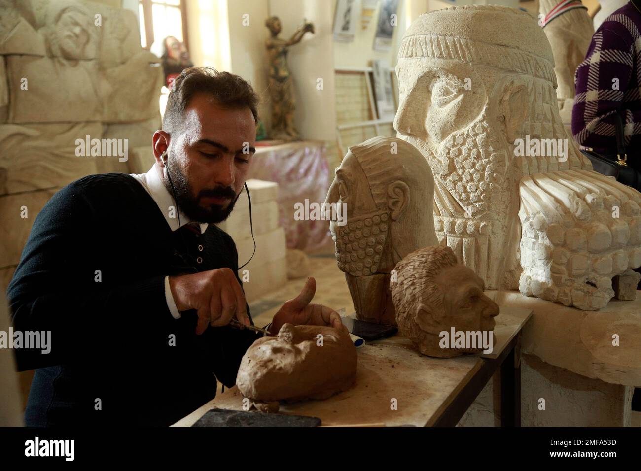 Saad Rhm Saad Rahim a sculptor works on artifacts figures destroyed by the ...