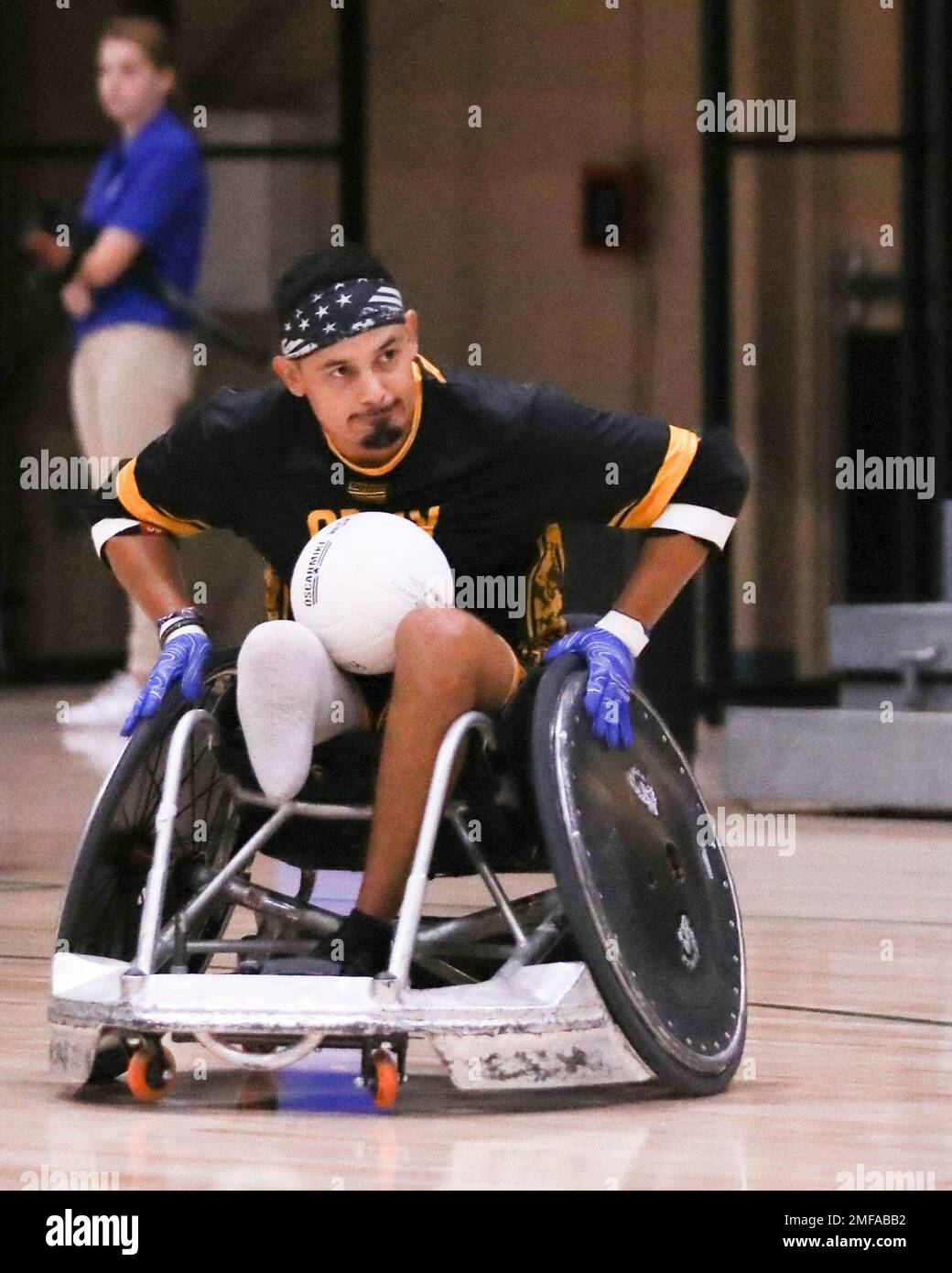 Retired U.S. Army Spc. Michael Villagran races down the court during  wheelchair rugby practice at the 2022 Department of Defense Warrior Games  at the ESPN Wide World of Sports Complex in Orlando,