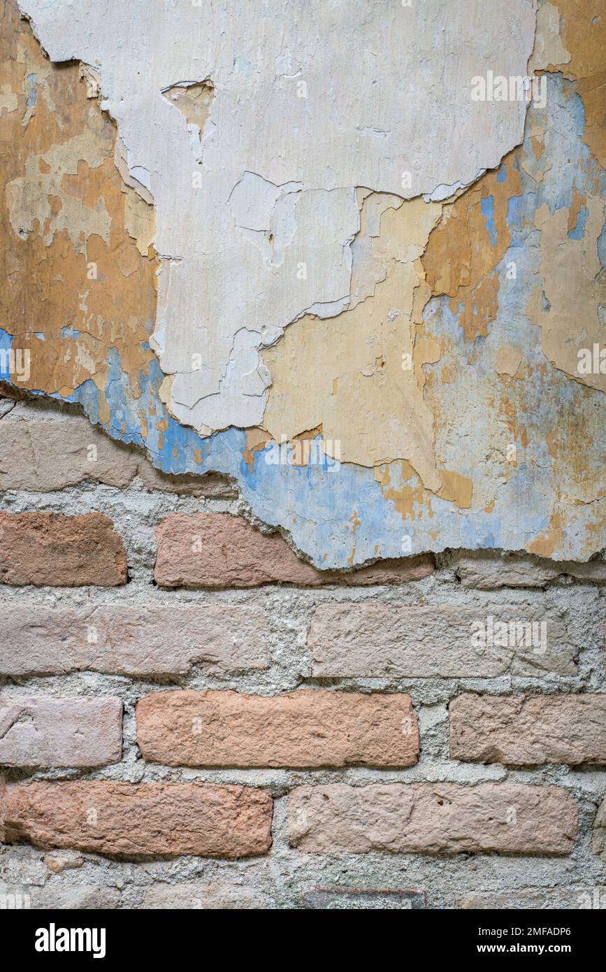 Grungy brick and peeled painted wall. Backdrop or background concept. Stock Photo