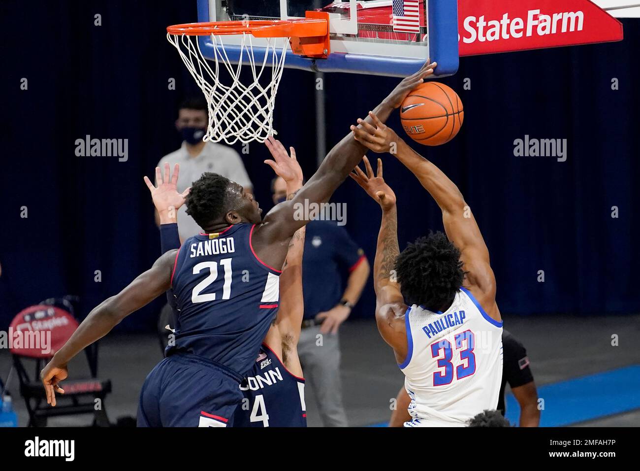 Connecticut's Adama Sanogo (21) blocks a shot by DePaul's Pauly ...