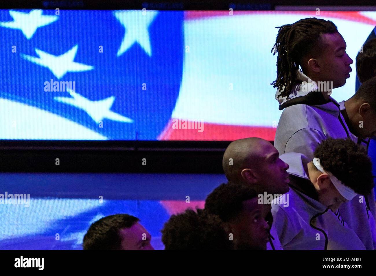 Oklahoma City Thunder players stand at attention during the fsinging of