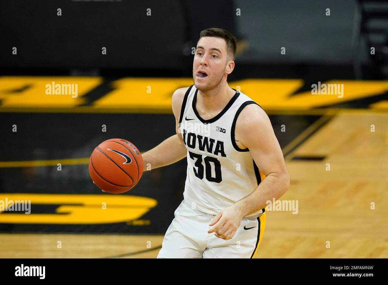 Iowa guard Connor McCaffery drives up court during the second half of