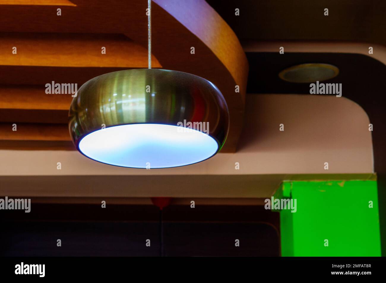 steel colored lamp hanging from the ceiling Stock Photo
