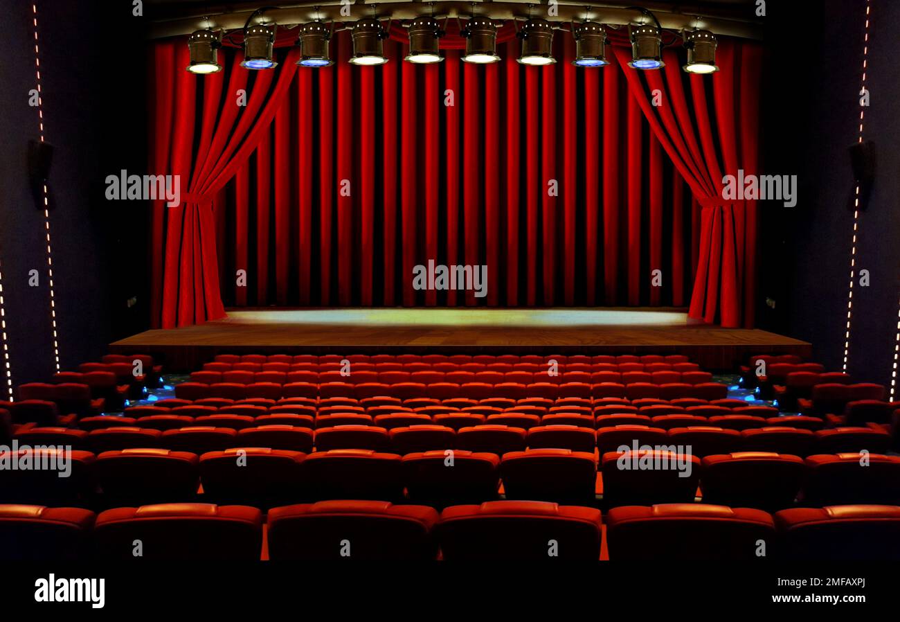 theater stage with red curtains and seats under spotlights Stock Photo ...