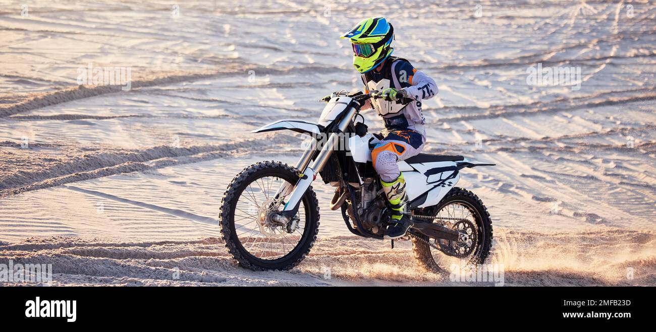 Motorcycle, desert race and extreme sport expert with agile speed, power or balance in nature. Motorbike man, rally and sand on fast vehicle with Stock Photo