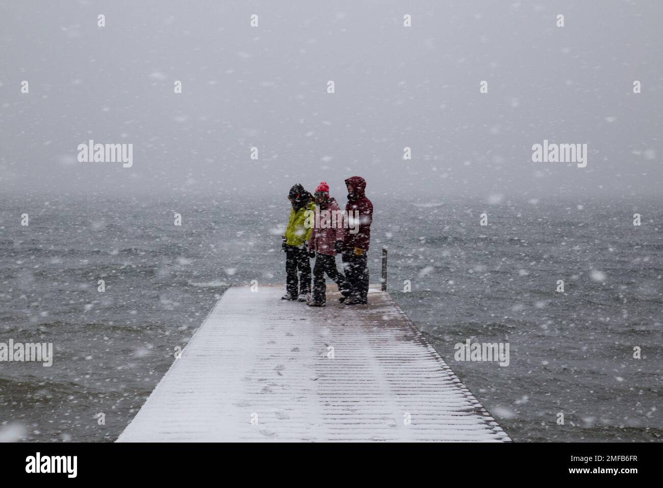 People on Dock in Snow Storm - California Stock Photo