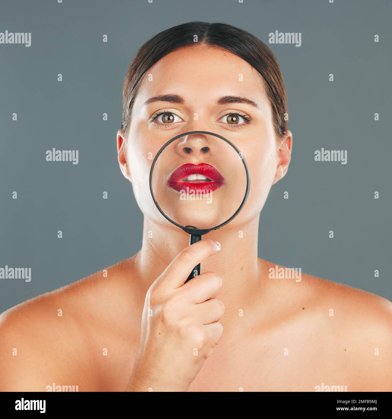 Beauty, magnifying glass and portrait of a woman in studio with a
