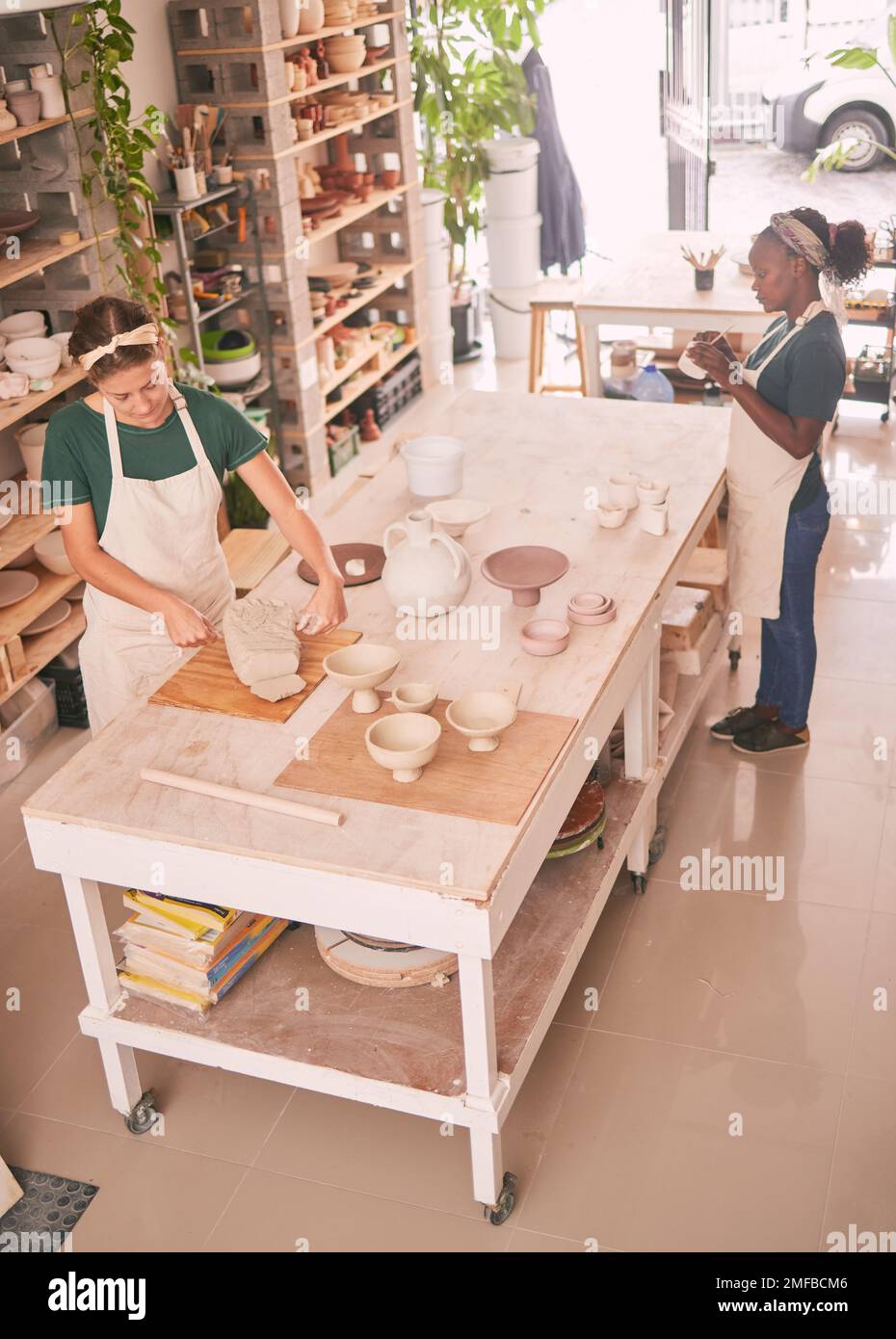 Pottery business and people sculpting together for creative process and productivity