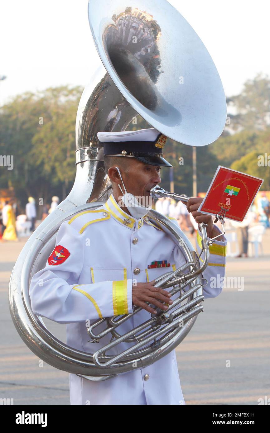 A military band parades during a ceremony to mark the 73rd anniversary