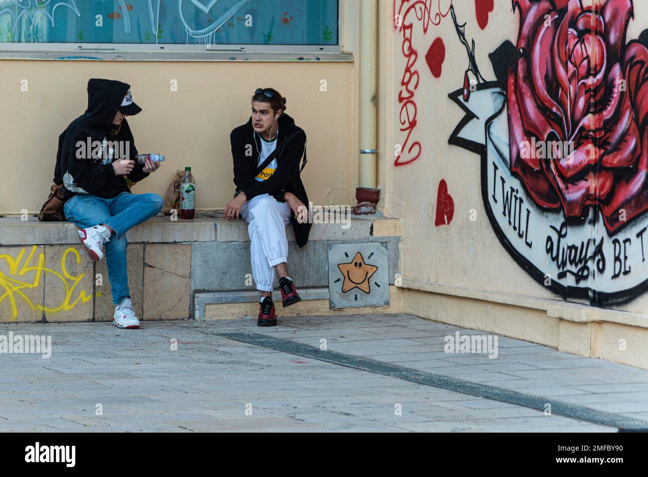 Two young men experiencing street life in Lyon, France Stock Photo
