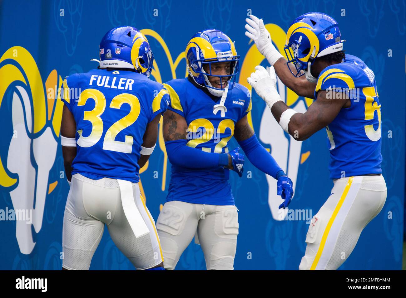 Los Angeles Rams cornerback Troy Hill (22), center, celebrates his