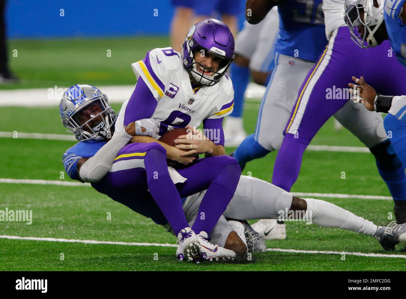 Minnesota Vikings quarterback Kirk Cousins (8) is sacked by Detroit