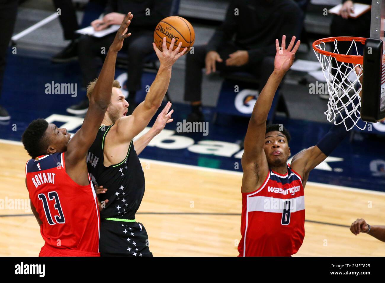 Minnesota Timberwolves forward Jake Layman shoots between Washington