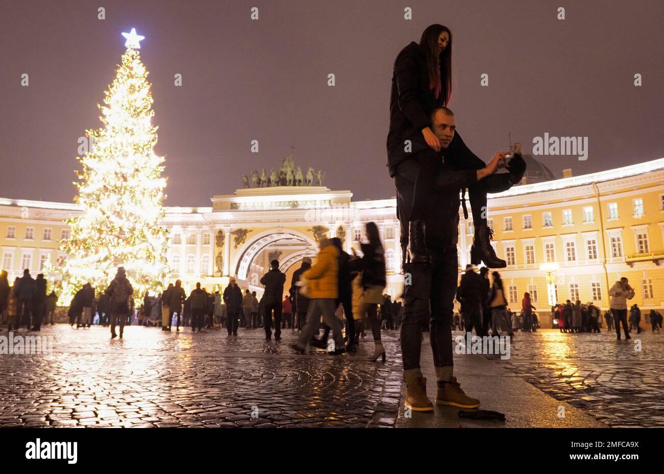 A couple take a selfie photo at the Palace Square during New Year
